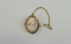 A Vintage - Nice Quality 9ct Gold Set Oval Shaped Cameo, with Attached 9ct Gold Safety Chain. Marked