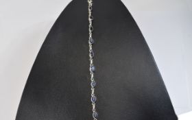 Silver Fashion Bracelet Each Link Collet Set With Blue Faceted Oval Stones,