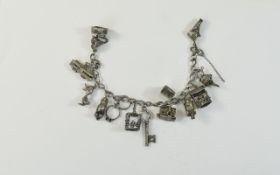A Silver Charm Bracelet, Loaded with 13 Good Quality Vintage Silver Charms.