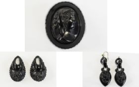 Whitby Jet Portrait Brooch and Two Pairs of Earring Drops, the brooch 2 inches high x 1.