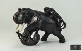 A Japanese 19th Century Fine and Impressive Heavy Bronze Sculpture of a Large Elephant Being