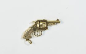 A Vintage and Bespoke Made 9ct Gold Charm In The Form of a Colt 45 with Revolving Barrel.