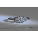 14ct White Gold Set 3 Stone Diamond Ring. The Princes Cut Diamonds of Good Colour. Marked 14ct.