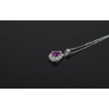 9 Carat White Gold Diamond Set Pendant central pear shaped pink sapphire surrounded by round cut