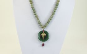 Early 20th Century Jadeite Necklace and Pendant; Jadeite freeform beads of different sizes in