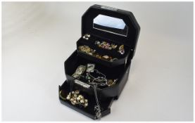 Black Jewellery Box containing a selection of costume jewellery,brooches, pendants, earrings,