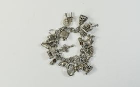 A Good Vintage SIlver Charm Bracelet Loaded with 20 Solid Silver Charms.