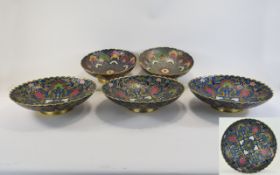 Collection of Five Enamelled Brass Bowls with scalloped edges floral decoration in pastel tones,
