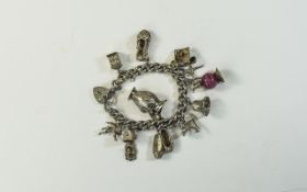 A Vintage Silver Charm Bracelet, Loaded with 11 Solid Silver Charms.