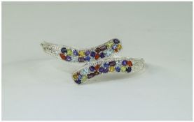 Multi Gemstone Crossover Bangle, set with fire opal, amethyst, sky blue topaz, peridot,