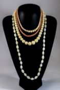 Three Various Coral Necklaces and one Mother-of-Pearl, the corals 21,17 and 16 inches long,