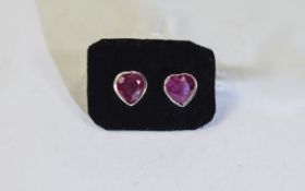 Pair of Ruby Heart Cut Stud Earrings, the heart cut solitaire rubies, bezel set in rose gold vermeil