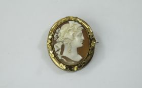 A Fine Quality Shell Cameo Within a Gold Frame Showing The Bust of a Classical Noble Lady.