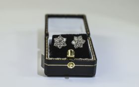 Pair of Ladies 18 Carat Diamond Cluster Earrings each set with 7 round brilliant cut diamonds,