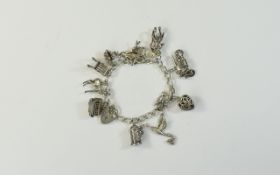A Vintage Silver Charm Bracelet Loaded with 12 Excellent and Detailed Silver Charms,