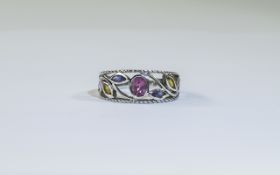 9 Carat White Gold Gemset Fashion Ring central oval between 6 marquis coloured gemstones.