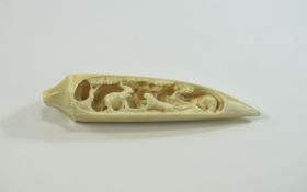 Intricately carved tiger's tooth just ov