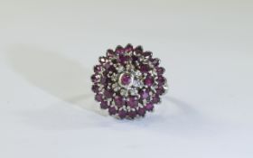 14ct gold ruby and diamond cluster ring,