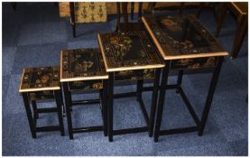 A Matching Set of 4 Graduated Side Tables, Decorated with Japanese Scenes on a Black Polished