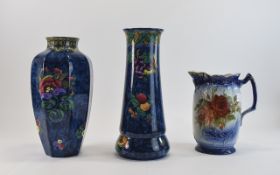 2 Losol Ware Vases; Both blue mottle ground Armado & Magnolia designs, shape numbers 5201 & 5390.