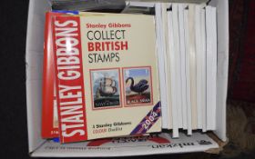 A box full of various stamp philatelic publications.