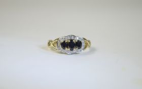 18ct Gold Diamond and Sapphire Cluster Ring 3 central oval sapphires surrounded by round cut
