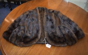 Mink Fur Cape dark mink fur cape with 2 small pockets. Shawl collar and hook and eye fastening.