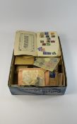 An A4 size box full of all world stamps both on and off paper in old envelopes sorted by country.