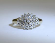 9ct Gold Set Diamond Cluster Ring. Marked 9ct. The Diamonds are Small But Bright. Est 50 pts.