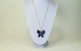 Purple Agate Butterfly Pendant, hand carved and edged with a gilt band,