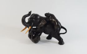 Japanese - Fine Naturalistic Bronze Sculpture of a Bull Elephant Being Attacked by Two Lioness.