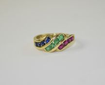 A Modern Fashioned 9ct Gold Set Ruby, Emerald and Sapphire Dress Ring.