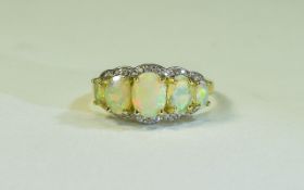 Natural Opal and and White Zircon Ring, five graduated, oval cut, natural Ethiopian opals with a