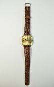Gents 1970s Omega Geneve Watch with gold plated cushion case and steel case back.