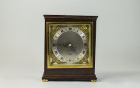 Elliot - Mahogany Cased 8 Day Mantel Clock with Silvered Chapter Ring and Cherub Mounted Corners.
