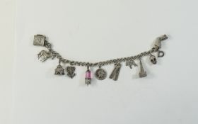 Vintage Silver Charm Bracelet Loaded with 11 Silver Charms. Includes a Scull Charm, Horse, Book,