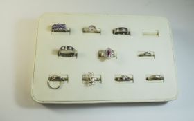 Collection of 10 Silver Dress Rings set with various coloured stones.