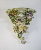 Sitzendorf Porcelain Wall Bracket decorated in bold relief with cherubs, flowers and foliage, 6 x