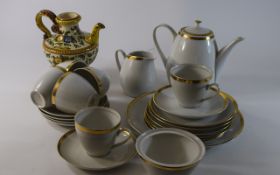 Modern White Coffee Set with gilt trim.