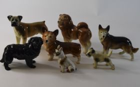 Collection of Seven Ceramic Dog Figures,