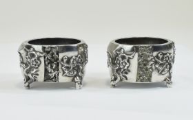 Chinese Silver Export Hand Crafted Pair of Ornate Salts with applied prunus flower decoration to