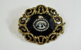 A Finely Worked and Well Made Victorian Black Enamel and Pinchbeck Oval Shaped Mourning Brooch with