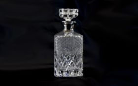 A Very Good Quality and Heavy Silver Collared Cut Crystal Decanter with Star Base.
