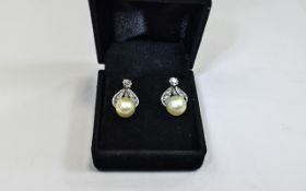 Ladies Diamond And Pearl Earrings Early 20thC Stud Earrings Each Set With An Old Mine Cut Above