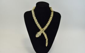 White Crystal Gilt Snake Necklace, an articulated gilt snake, studded with white crystals, the