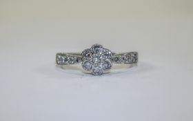 Ladies 9ct Gold Set Diamond Cluster Ring with Flower head Setting and Diamond Shoulders.