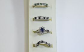 4 x Silver Stone Set Rings Set of stacking rings in various designs featuring flowerhead setting,