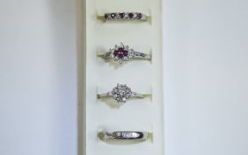 4 x Silver Ruby rings Set of 4 pretty staking rings of varying design featuring plain twisted band,