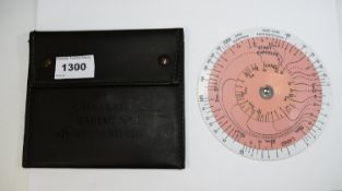 Radiac Calculator Radiac No1, rotary white plastic disc housed in field green leather pouch.