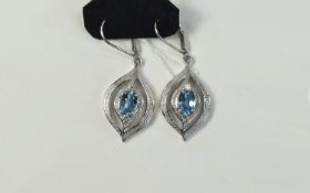 Swiss Blue Topaz Pair of Drop Earrings, two oval cut solitaires, each of 1.